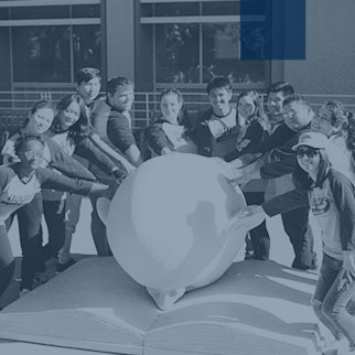 FYAC - Students posing around an Egg Head